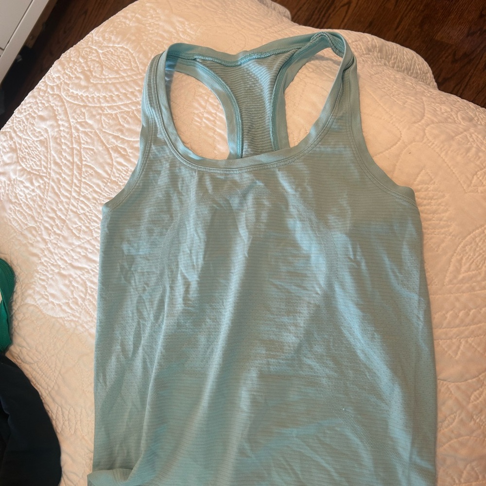 FOUR. 4. Set of women's Lululemon Racerback Tank Top